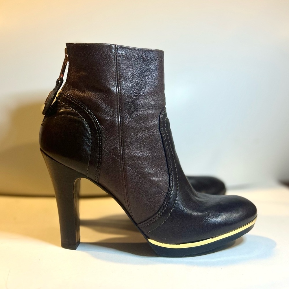 Tory Burch Brown Leather With Gold Metal bid Ankle Boots.